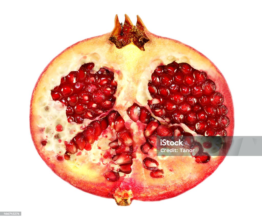 delicious half pomegranate bright tasty pomegranate half on a white background 2015 Stock Photo