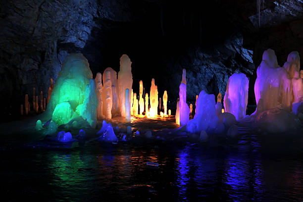 istock Frozen water Stalagmite in deep marble cave, Russia 466744161