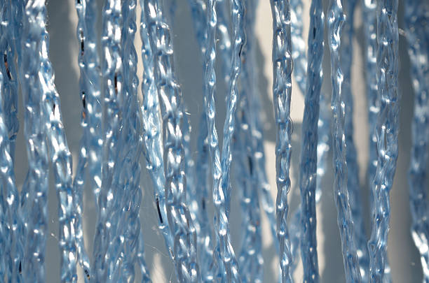 fil bleu avec argent - chrome metal tied knot twisted photos et images de collection
