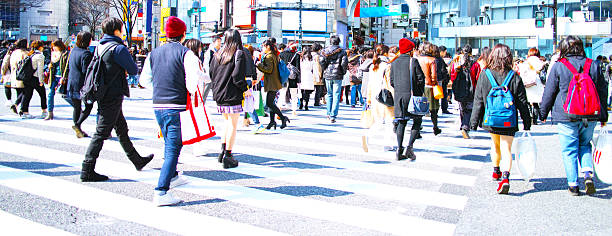 Crowd walking crosswalk stock photo