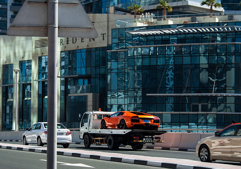 Dubai, UAE - February 29, 2012: Lamborghini Aventador evacuation in Dubai marina district. UAE