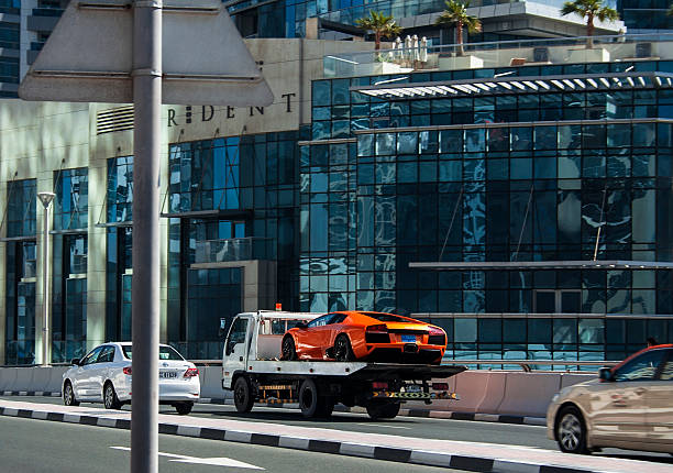 Lamborghini evacuation Dubai, UAE - February 29, 2012: Lamborghini Aventador evacuation in Dubai marina district. UAE towing photos stock pictures, royalty-free photos & images