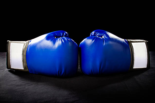istock Blue Boxing Gloves on a Black Background 466745678