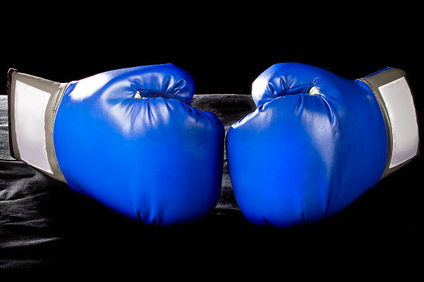 istock Blue Boxing Gloves on a Black Background 466745682