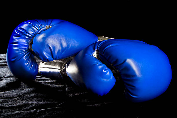 istock Blue Boxing Gloves on a Black Background 466745686