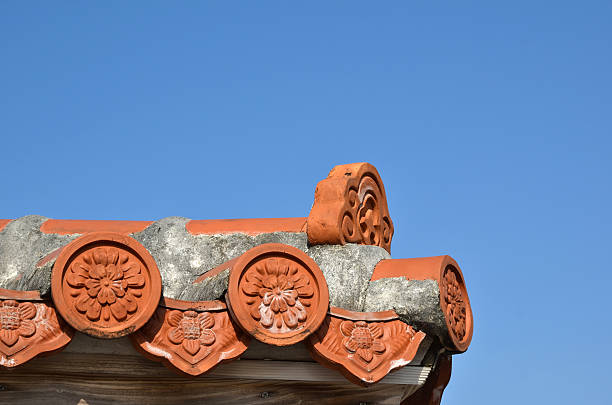Detail from a traditional tiled roof at the island Okinawa in Japan. The Japanese island Okinawa is one of Japan´s southernmost islands. The climate at Okinawa is subtropical and the beaches are considered among the world´s most beautiful.