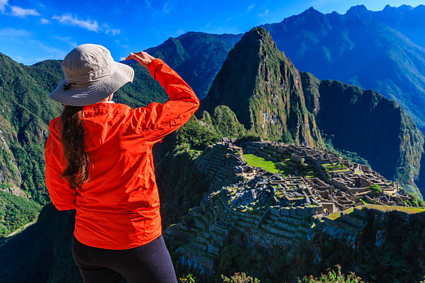 istock Female tourist looking at Machu Picchu 466748919