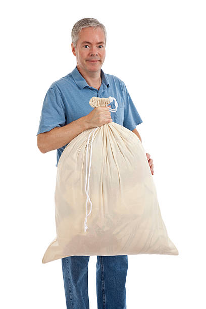 istock Man With a Bag of Laundry 466749167