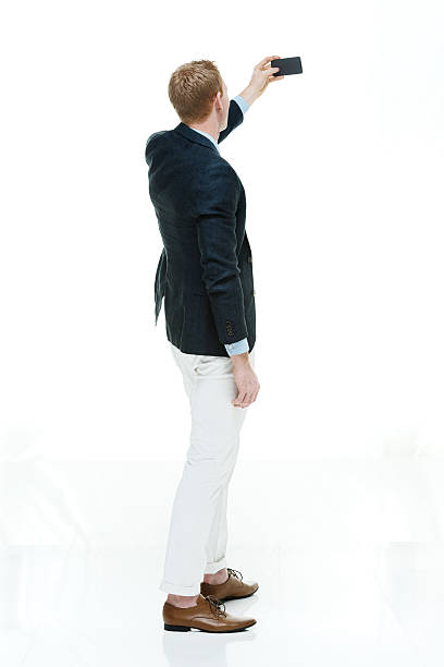 istock Fashionable man taking a selfie 466750338