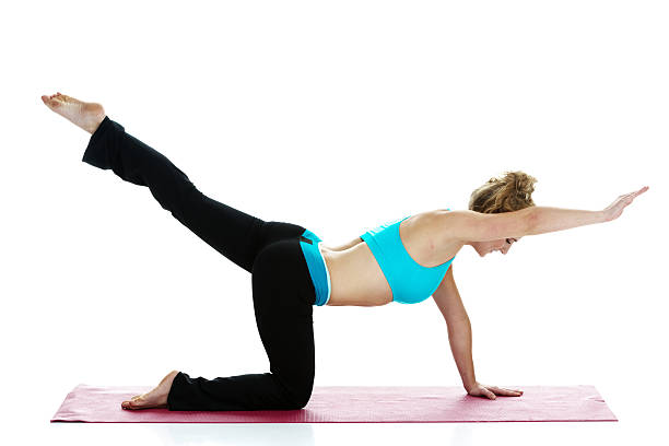 istock Female doing yoga on exercise mat 466750352