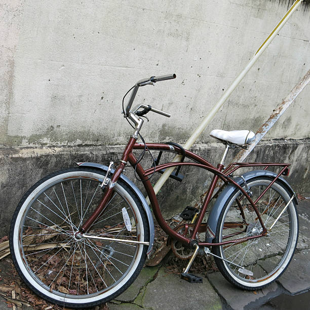 istock Retro Bicycle Leaning on Cables and Old Building 466750674