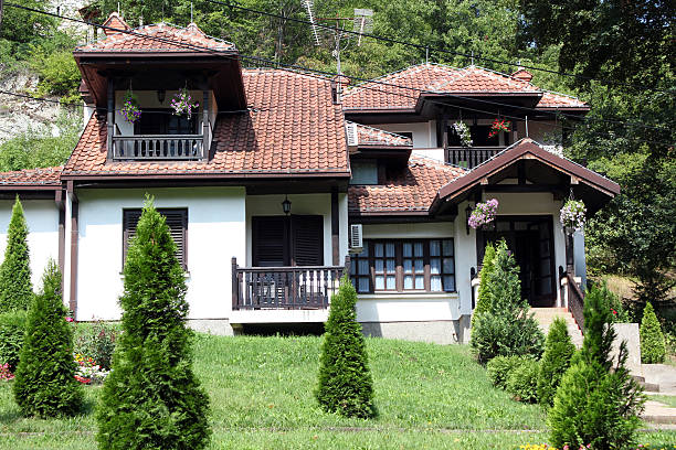 istock house with flowers and plants on hill 466750817
