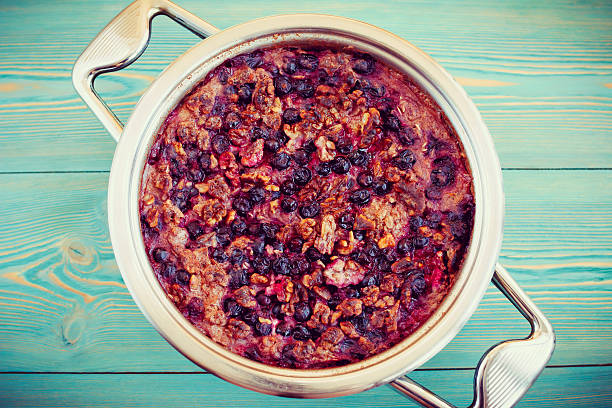 istock Oatmeal, walnut and black currant casserole in pan 466751016