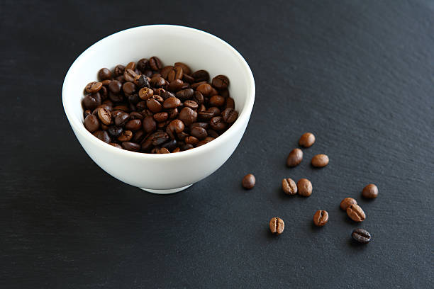 istock Coffee beans in a bowl on slate 466751496