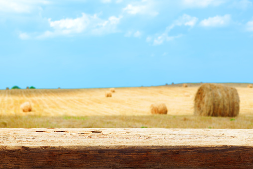 hay bale field blur tabletop wooden background shallow DOF