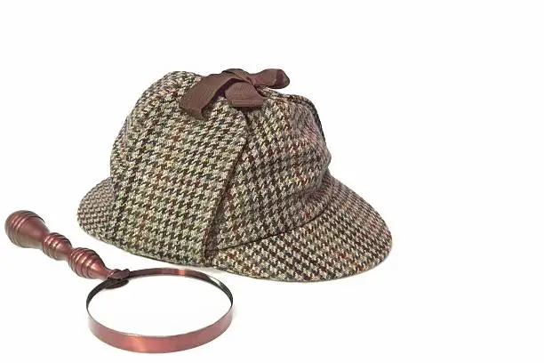 Sherlock Holmes Hat or  Deerstalker Hat and Retro Magnifying Glass Isolated on White