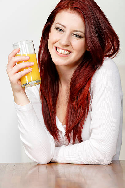 istock Happy woman with fresh Orange juice 466757464