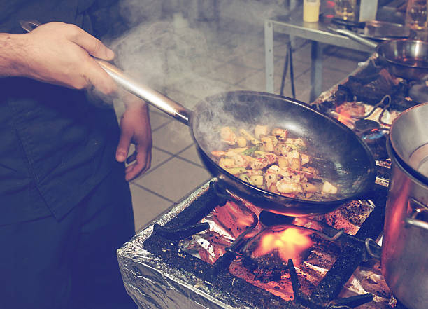 istock Chef is cooking seafood dish, toned 466758252