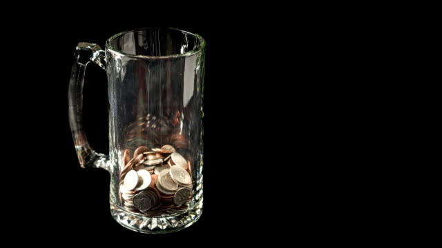 Stop Motion Animation of Coins Filling Beer Mug