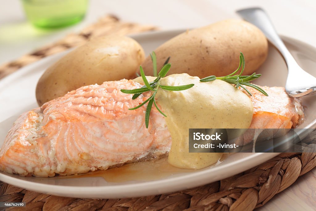 Salmon with potato Baked salmon under mustard sauce with boiled potato Salmon - Seafood Stock Photo