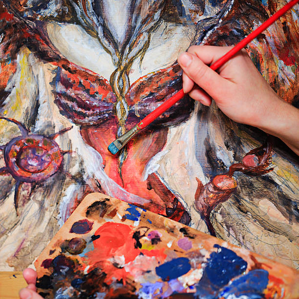 istock Artist's hand Paint a picture 466762838