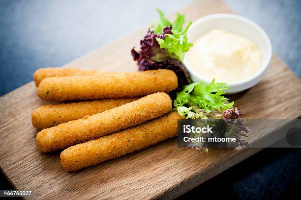 Mozzarella Sticks On A Plank With Dipping Sauce And Greens Stock Photo - Download Image Now