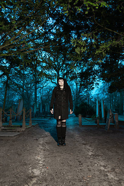 istock Gothic fashion girl on cemetery. 466766021