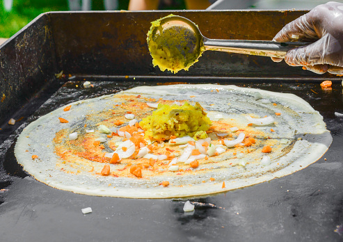 Indian cooking of Dosa, a popular south Indian dish