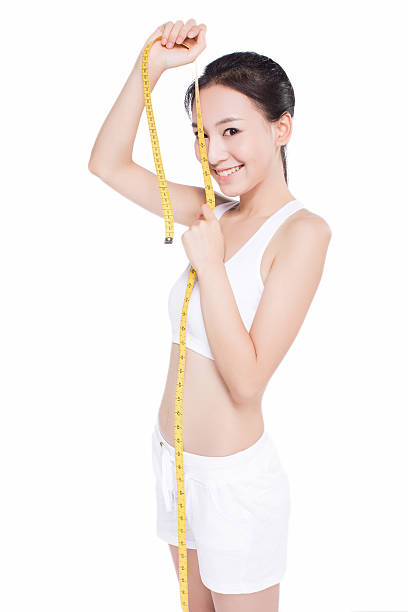 istock woman with measure tape 466767926