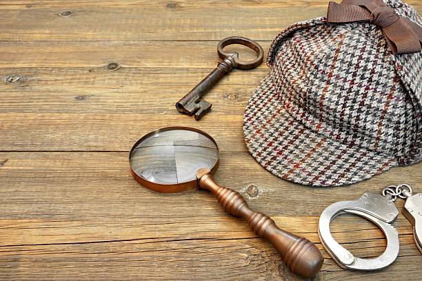 istock Detective Deerstalker Cap, Magnifier, Handcuffs, Key On Table Background 466770468