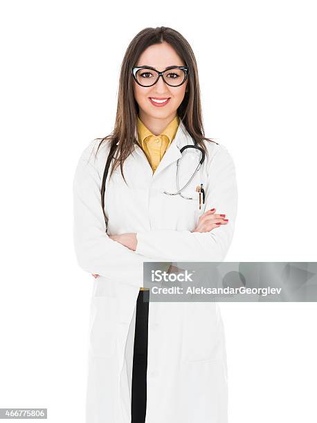 Young Attractive Female Doctor How Smiling And Wearing Medical Uniform Stock Photo - Download Image Now