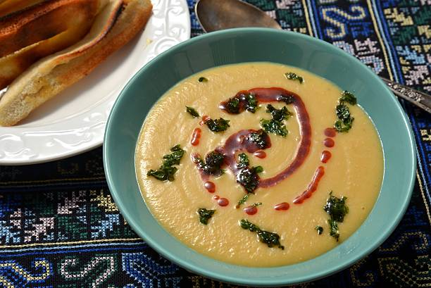 istock Palestinian lentil and vegetables creamed soup with fried pita bread 466778944