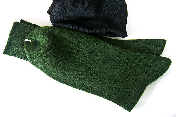 istock Men  green and black socks on white background 466785568