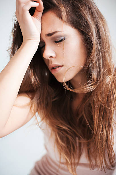 istock The beautiful girl with a headache 466785898