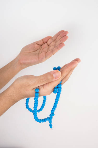 istock Prayer beads and rosary chanting 466786571