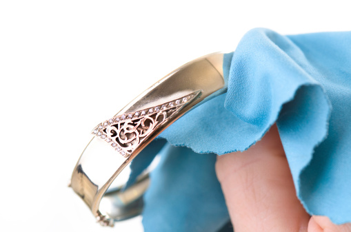Polishing jewelry with a cloth