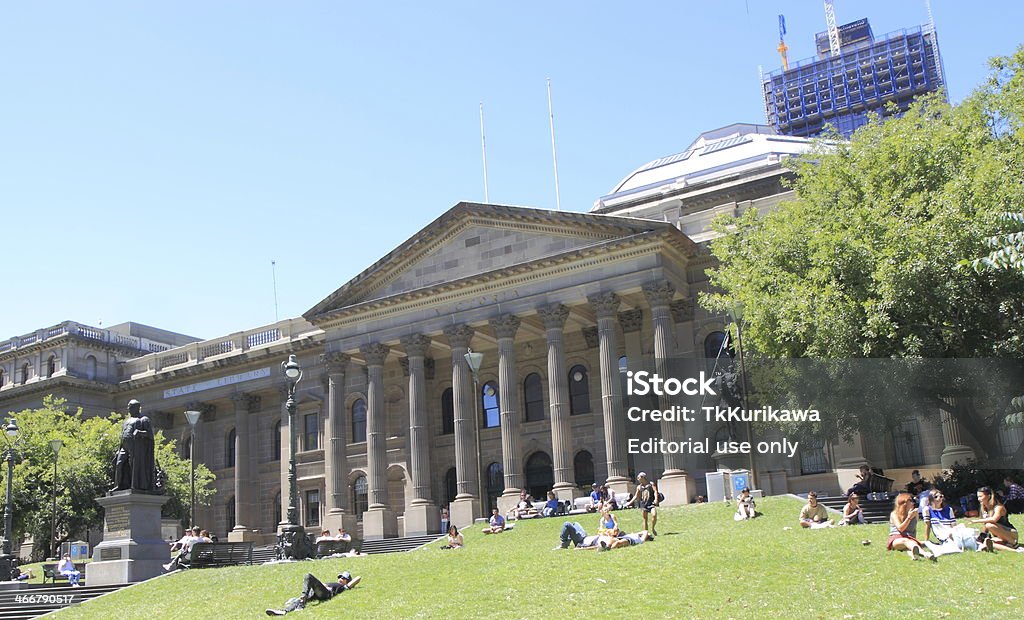 State Library Melbourne Melbourne Australia- January 26,2014: Local people relax in the lawn area in front of the State Libraly Melbourne Australia Stock Photo