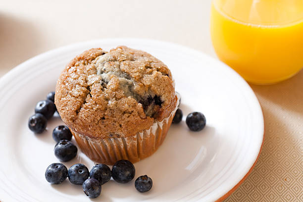 istock Blueberry muffins and orange juice 466791345