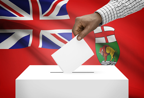 Voting concept - Ballot box with Canadian province flag on background - Manitoba