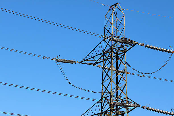 istock Image of electricity pylon / transmission tower, cage, wires, insulators, sky-background 466797624