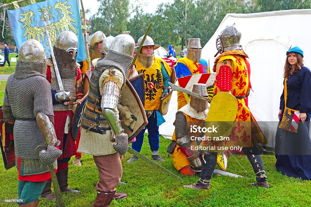 Reconstruction of the war scenes  Tambov, Russia - September 7, 2013:  Reconstruction of the war scenes in medieval costumes in the streets of Tambov.  Young people demonstrate costumes homemade 2015 Stock Photo