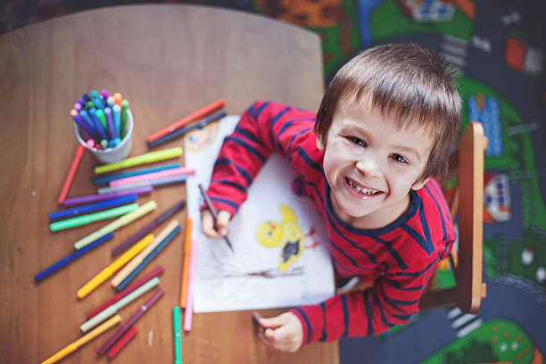 istock Adorable little boy, drawing picture for easter 466797800