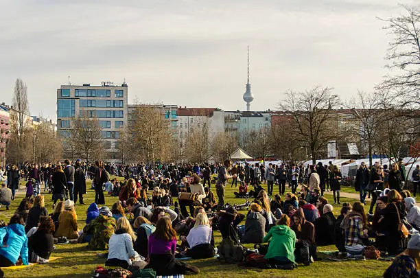 People enjoying a sunny Sunday afternoon in Mauer (Wall) Park in the Prenzlauer Berg area of former east Berlin.