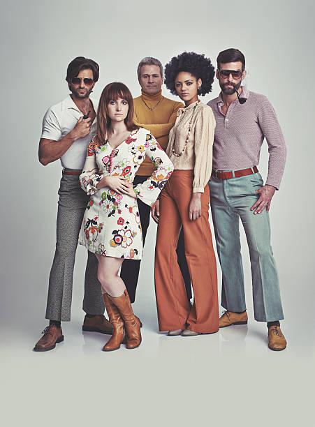 Nothing like some 70s style! A studio shot of a group of people standing together while clad in retro 70s wearhttp://195.154.178.81/DATA/istock_collage/0/shoots/782690.jpg vintage fashion stock pictures, royalty-free photos & images