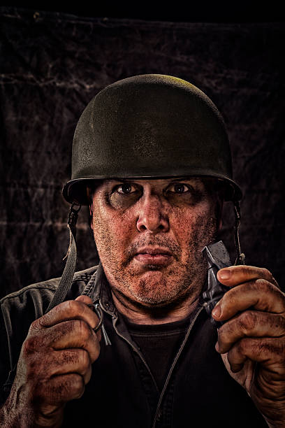 istock Vintage Army Soldier pulling pin on hand grenade 466801880