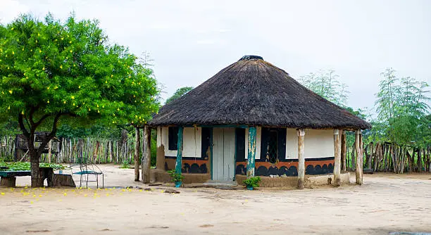 A typical guestroom in a kraal, in Matebeleland, Zimbabwe. The rooms are built of mud and thatch, and are ornately decorated, inside and out.