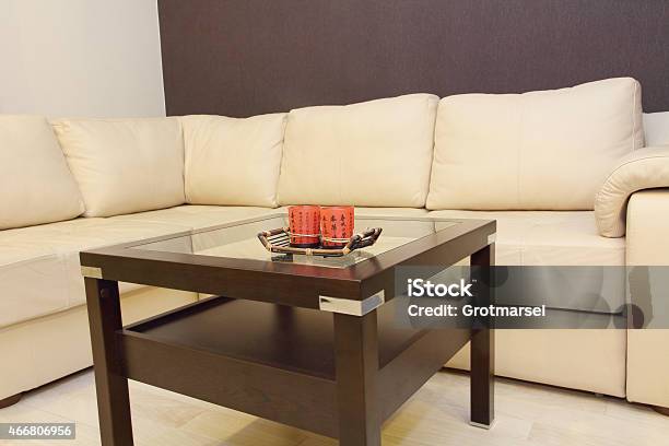 Coffee Table And Comfortable White Corner Leather Sofa Stock Photo - Download Image Now