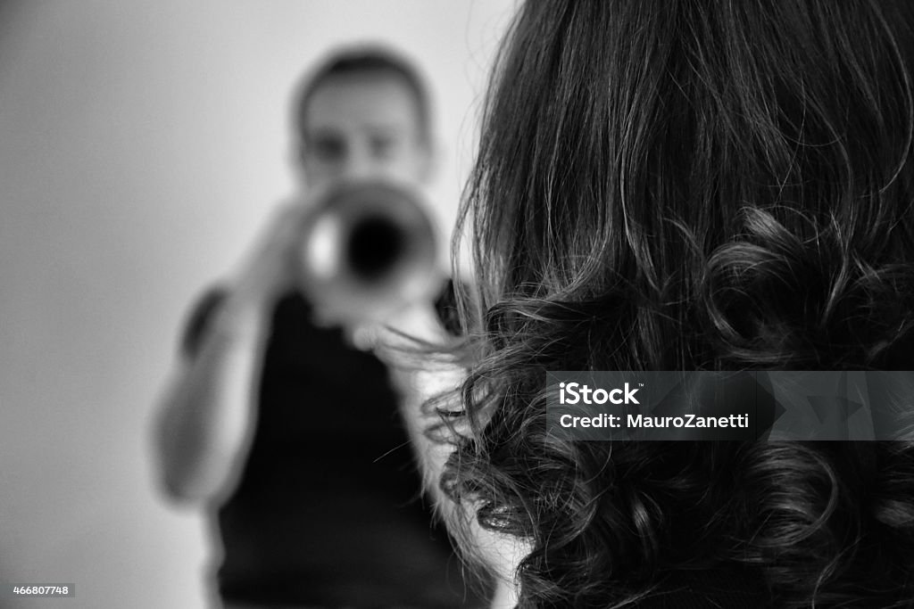 Playing on a trumpet Black and white, high contrast image man playing on a trumpet 2015 Stock Photo