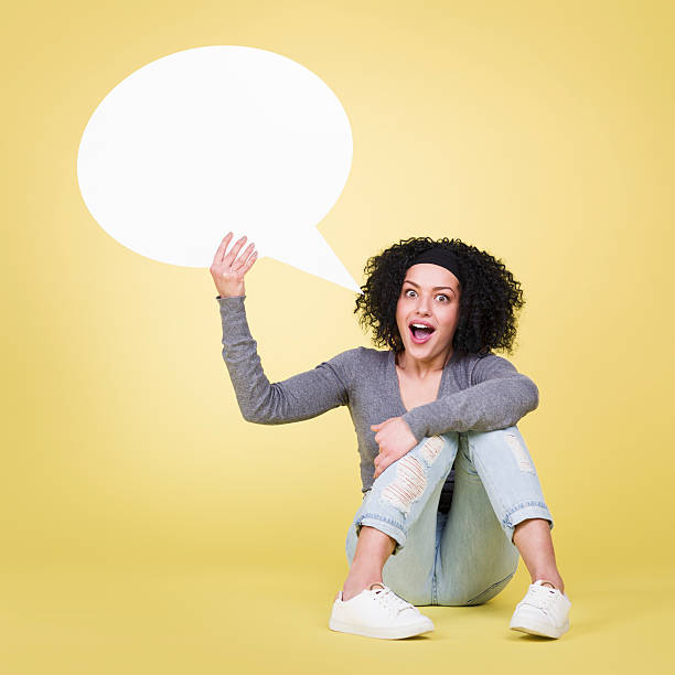 istock Happy girl holding empty speech bubble. 466807820