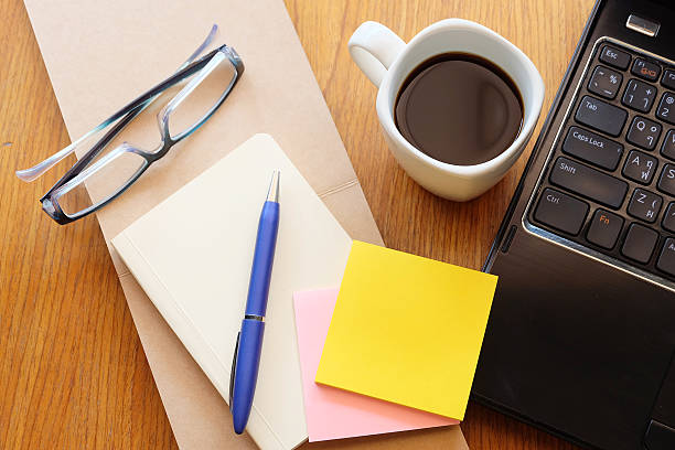 istock note book and laptop on wooden table with coffee 466807948
